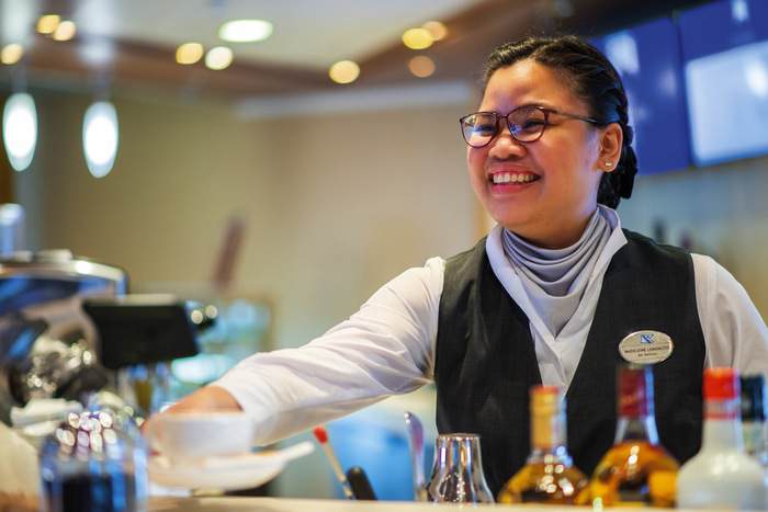 Fred. Olsen Cruise Lines Staff member in The Bookmark Café on Bolette.jpg